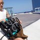 Image for article titled You Can Squeeze the World's Most Compact Folding Stroller Into a Shoulder Bag